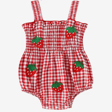 A red and white gingham romper with embroidered strawberry details and a matching gingham bow headband, displayed on a light gray background.